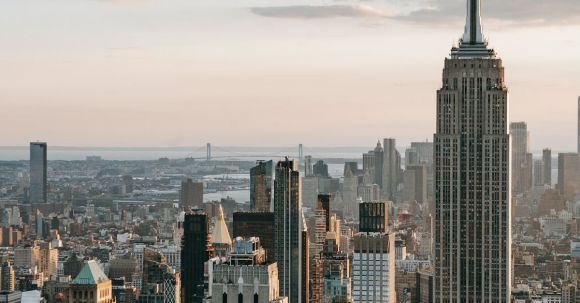 Profitable Empire - Empire State Building near skyscrapers in USA